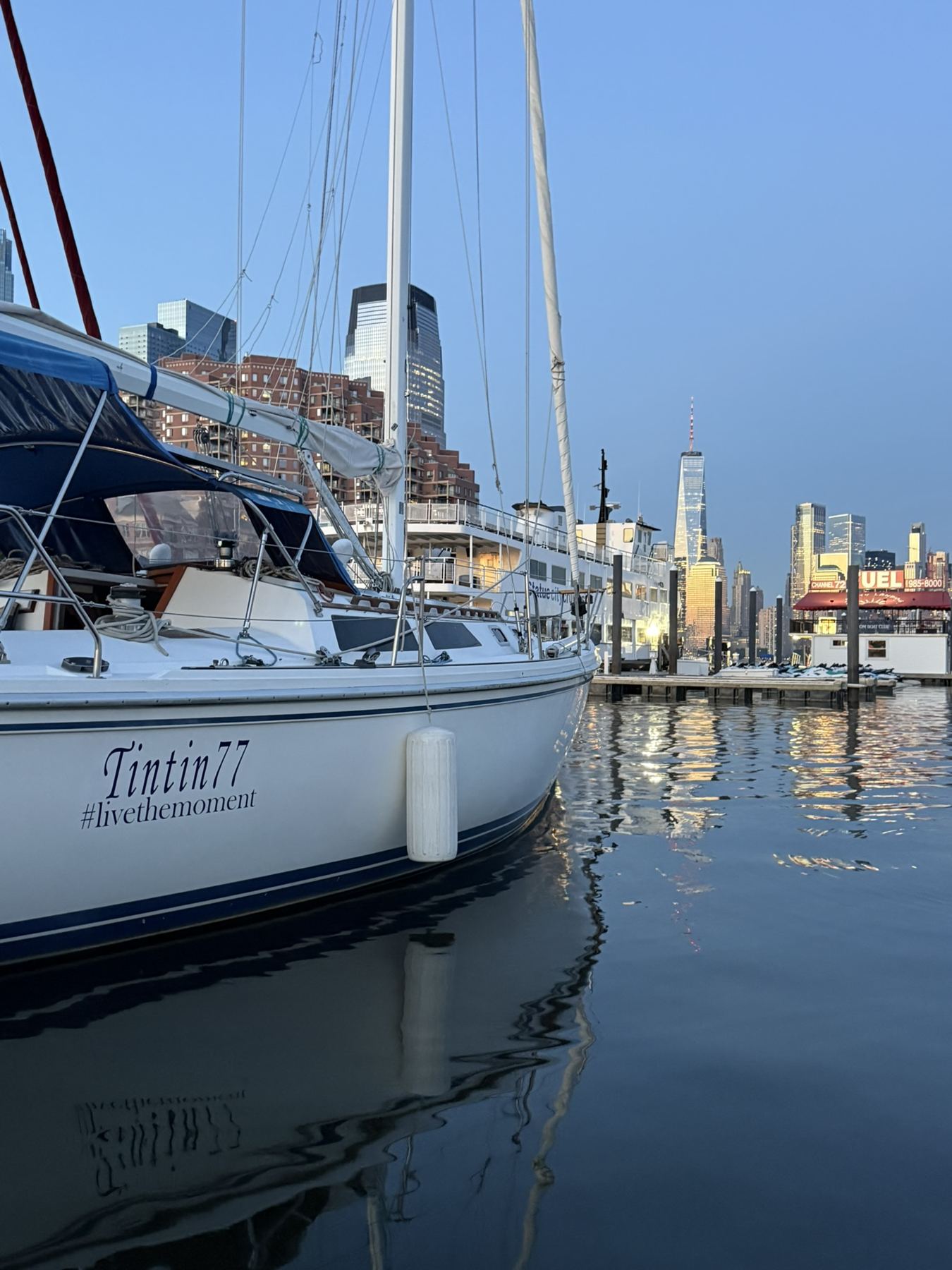 TinTin77 at her slip with One World Trade Center behind